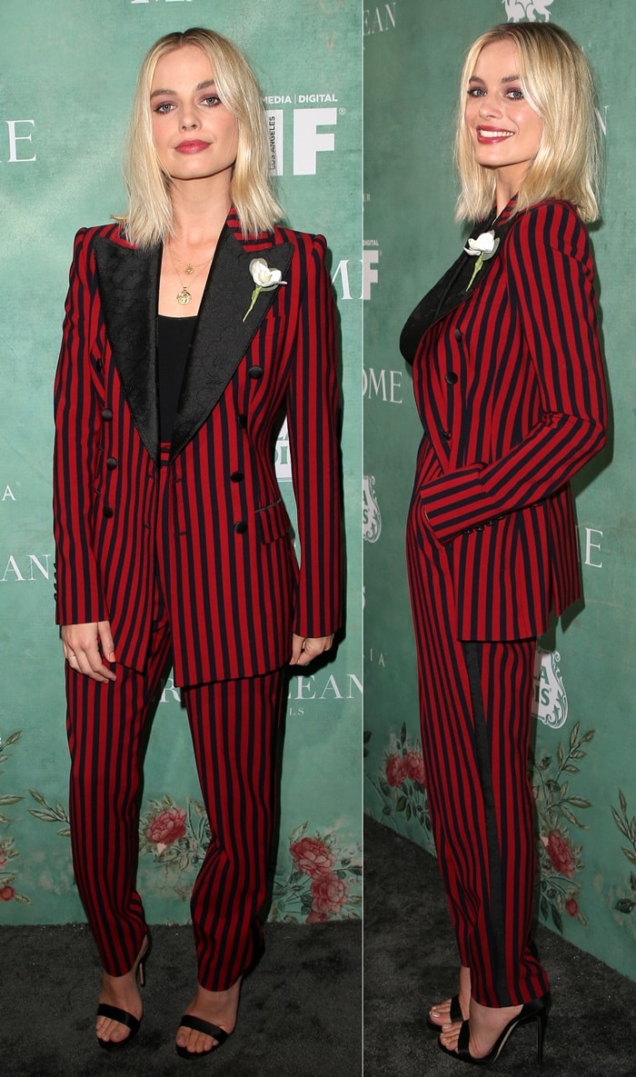 Margot Robbie wearing an androgynous black & red stripe two-piece suit by Dolce & Gabbana