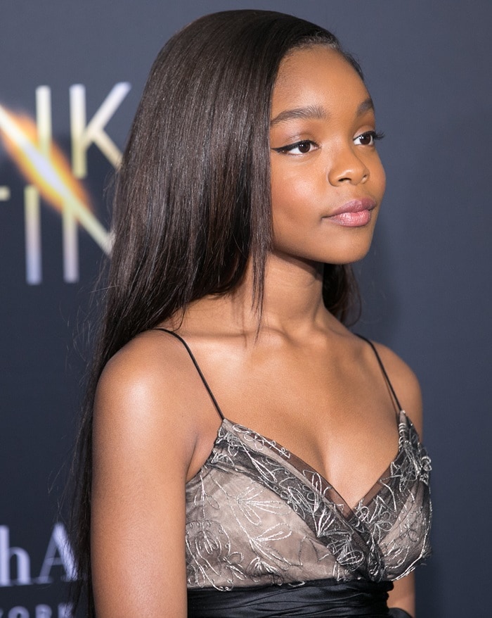 Marsai Martin exudes elegance with her sleek, straight hairstyle and subtle makeup, featuring a soft pink lip and defined eyeliner, at the premiere of A Wrinkle in Time