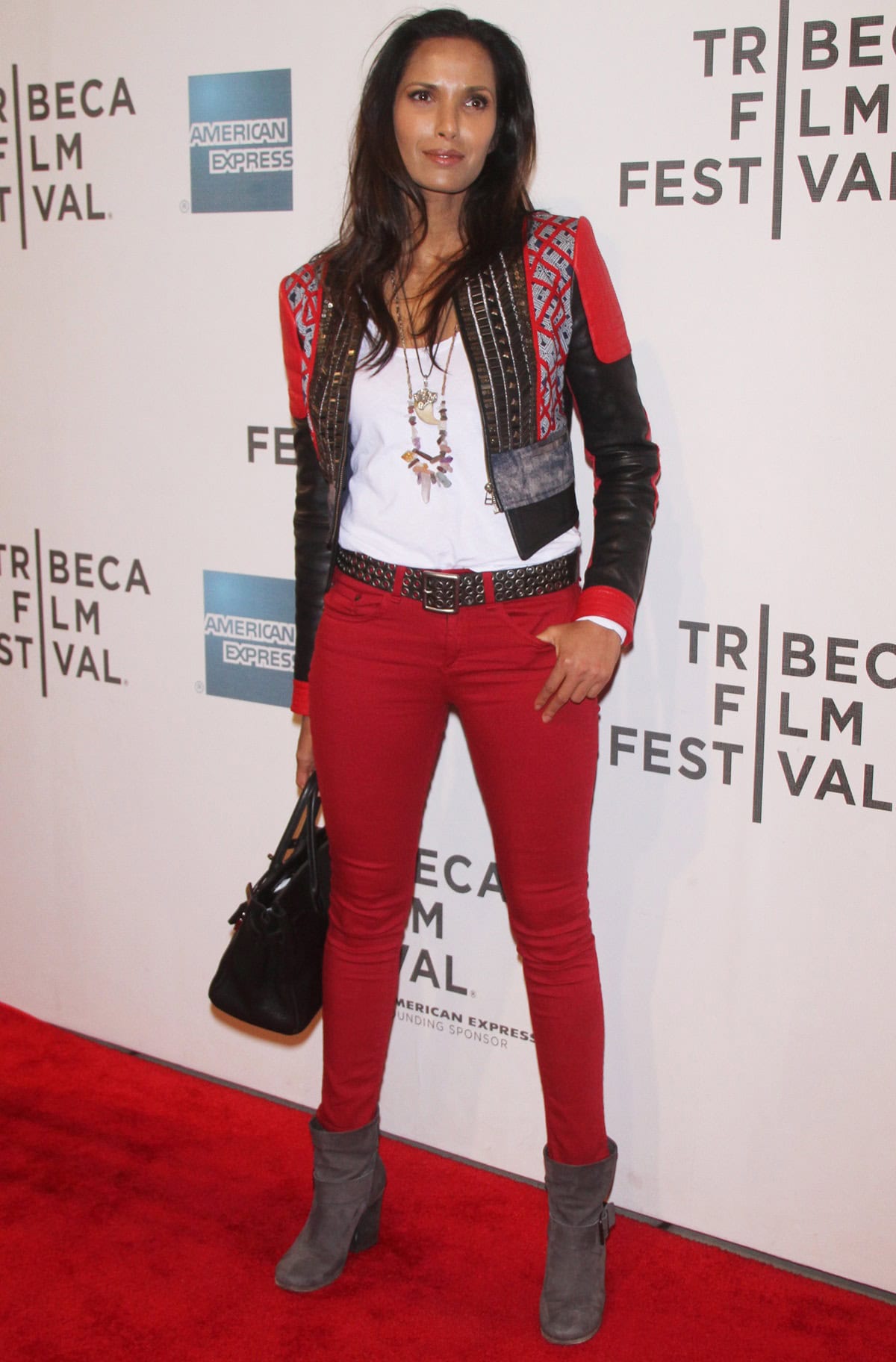 Padma Lakshmi's stylish ensemble is completed with gray ankle boots and a statement necklace, exuding effortless chic