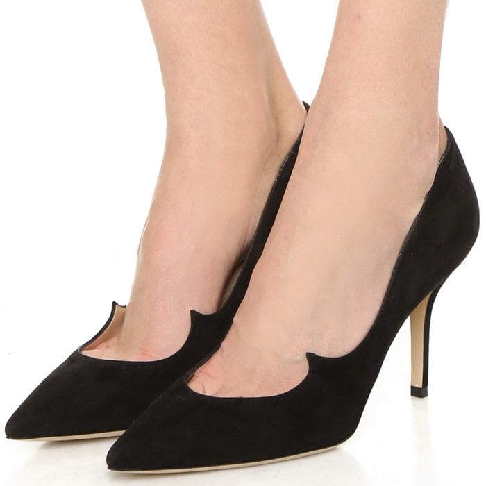 Luxurious black suede pointy-toe pumps with peaked wing detail