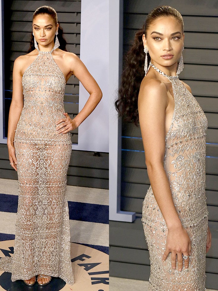 Shanina Shaik giving eyefuls of her nude bra cups and underwear in a Georges Hobeika Spring 2018 Couture halter gown and silver Stuart Weitzman sandals at the 2018 Vanity Fair Oscar Party.