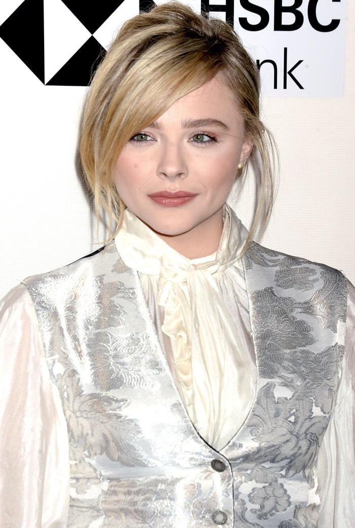 Chloë Grace Moretz's white bishop sleeve, tie neck blouse