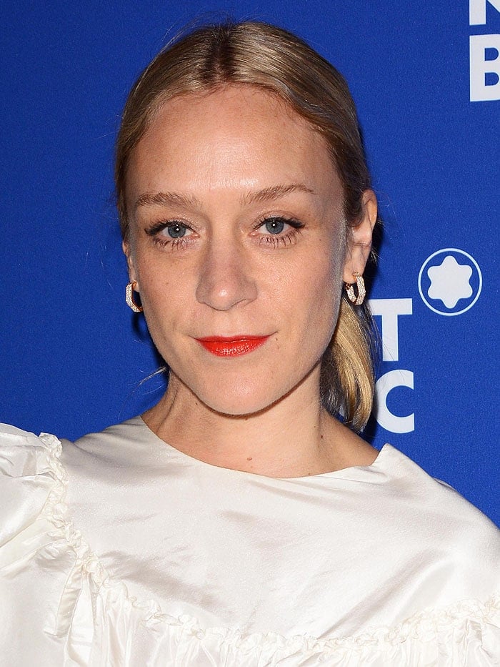 Chloe Sevigny rocking orange lipstick.