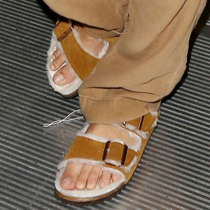 Details of the furry Birkenstock 'Arizona' sandals on Emily Ratajkowski.