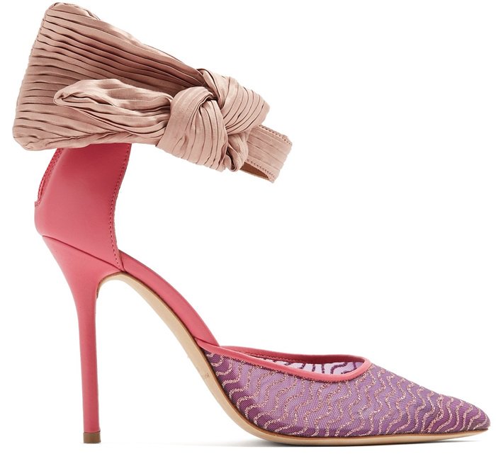 These pink pumps feature metallic waves across the pointed toes, hot-pink piped edge trim, and a dramatic pleated-bow ankle strap