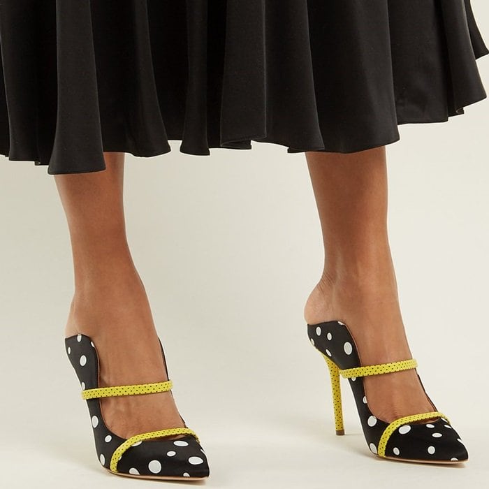 These white polka-dot pumps reinterpret key themes from the archives of the classic French couture house