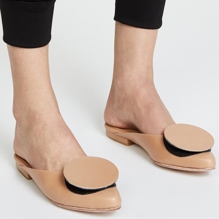 A minimalist pair of Palatines mules promises to provide a little originality with even more luxury in smooth leather that will pair with any ensemble from casual to bridal