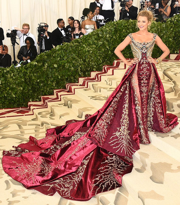 Blake Lively in Atelier Versace ruby-red-and-gold embellished gown and custom Christian Louboutin heels.