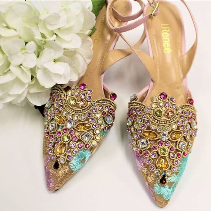 Elegant embroidery and sparkling crystals embellish the pointy toe of a gorgeous, sparkling pump secured by a slim strap that wraps around the ankle