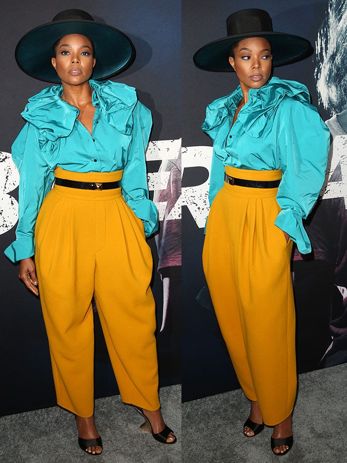 Gabrielle Union wearing a Marc Jacobs blue ruffled blouse and yellow pants with Salvatore Ferragamo curved wedges.