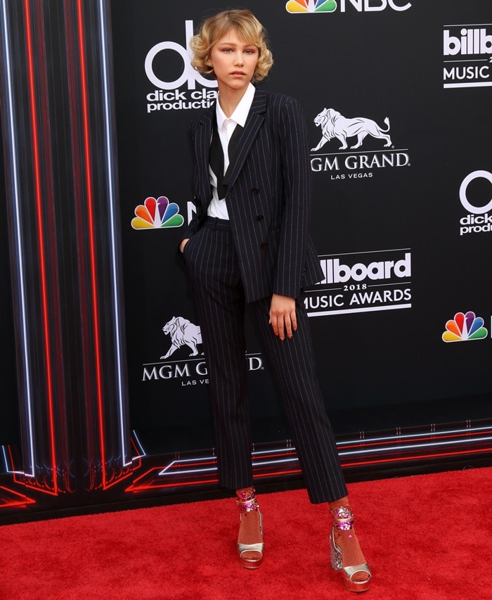 Grace VanderWaal brought playful polish to the red carpet in a tailored pinstripe BOSS suit, pairing it with glittery Chinese Laundry 'Tayla' platform sandals and custom-made colorful socks