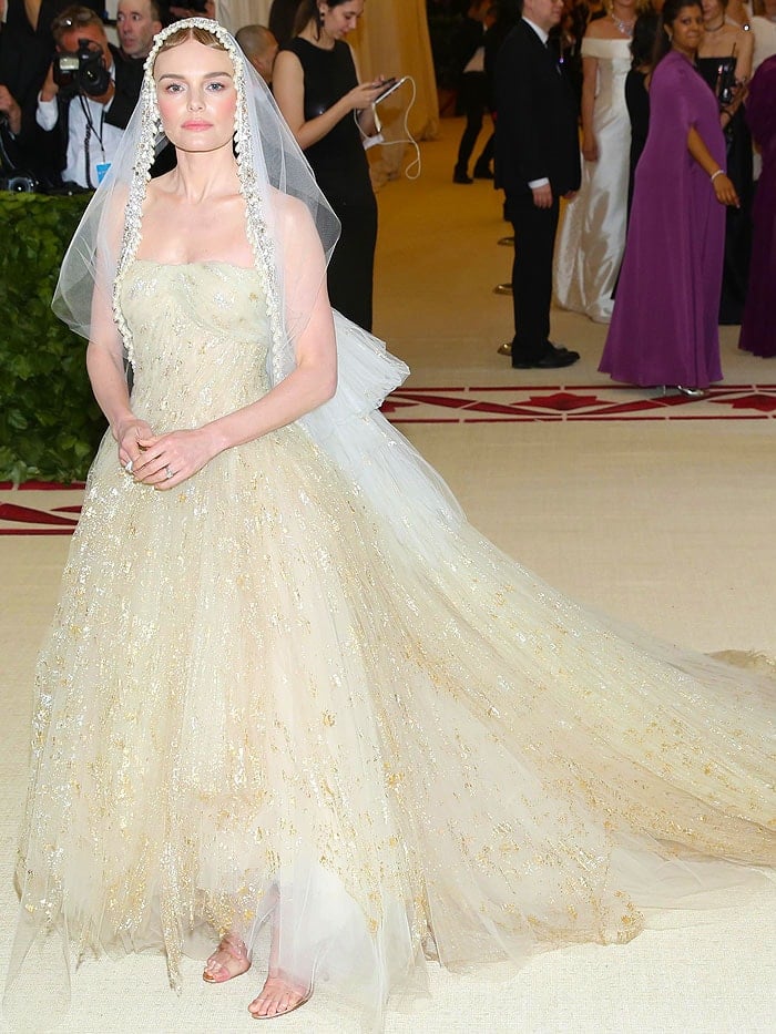 Kate Bosworth wearing an Oscar de la Renta gown and veil with Manolo Blahnik 'Estro' sandals.