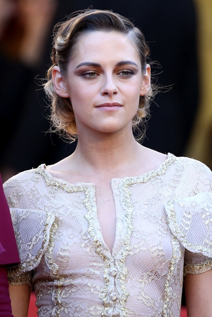 Kristen Stewart stuns in an intricately embroidered Chanel Haute Couture lace dress with delicate gold accents