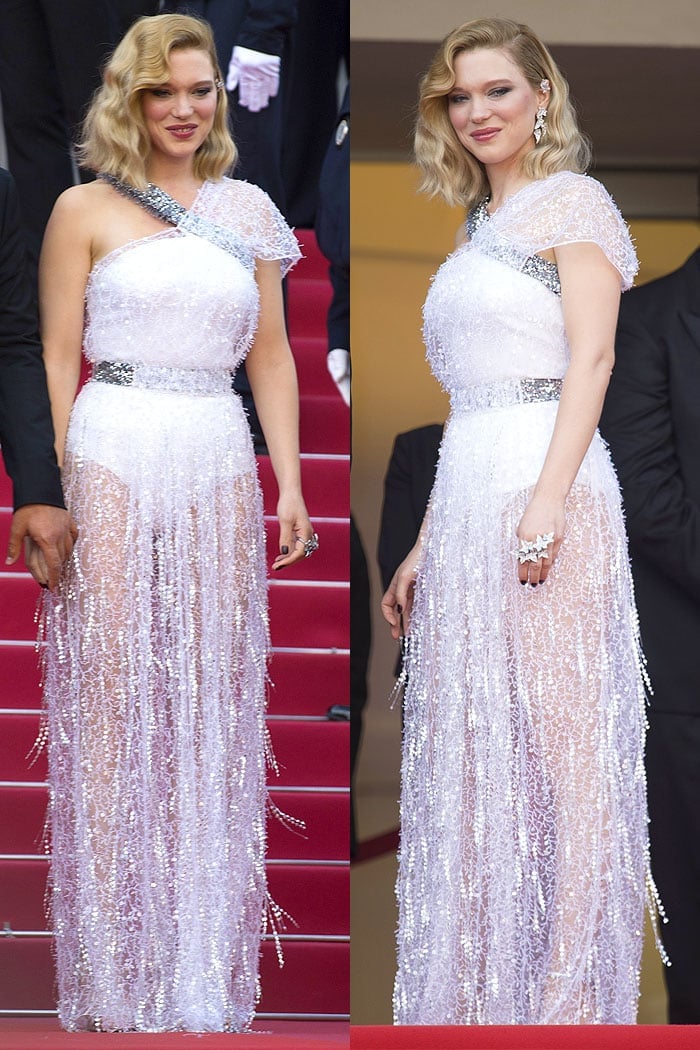 Lea Seydoux in a custom Louis Vuitton tinsel-embellished white-silk gown and Louis Vuitton silver ankle-strap sandals.
