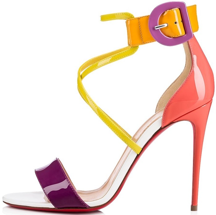 This high-heeled patent leather sandal in vibrant retro tones features an aerial cut with an upper double strap and adjustable ankle strap