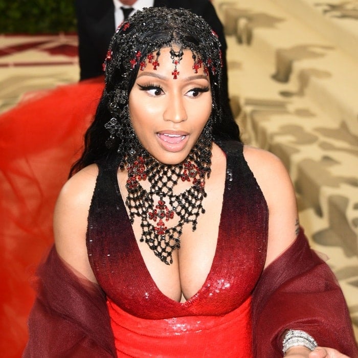 Nicki Minaj wearing a custom Oscar de la Renta rosary headpiece.