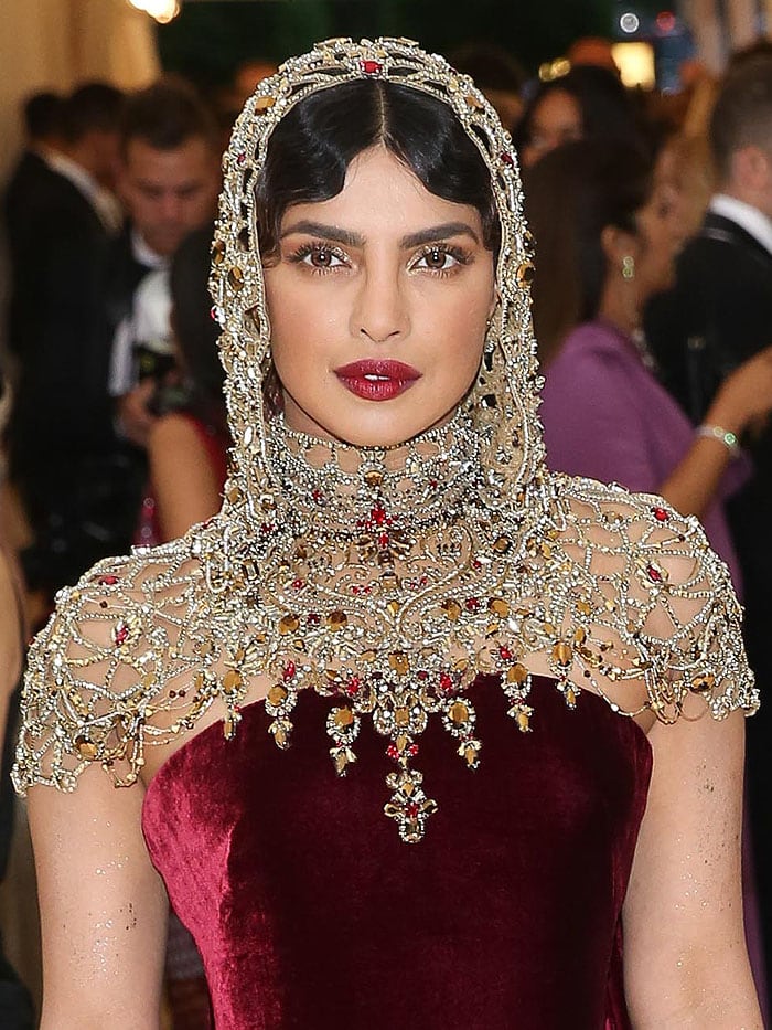 Priyanka Chopra wearing a jeweled hooded headpiece.