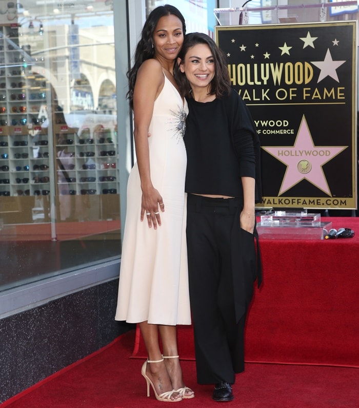 Mila Kunis rocking black Oxfords from Frye featuring hand-applied micro studs