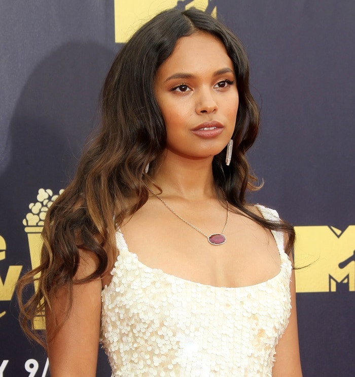 Alisha Boe showing off her ruby, diamond & yellow gold necklace at the 2018 MTV Movie & TV Awards at Barker Hangar in Santa Monica, California, on June 16, 2018