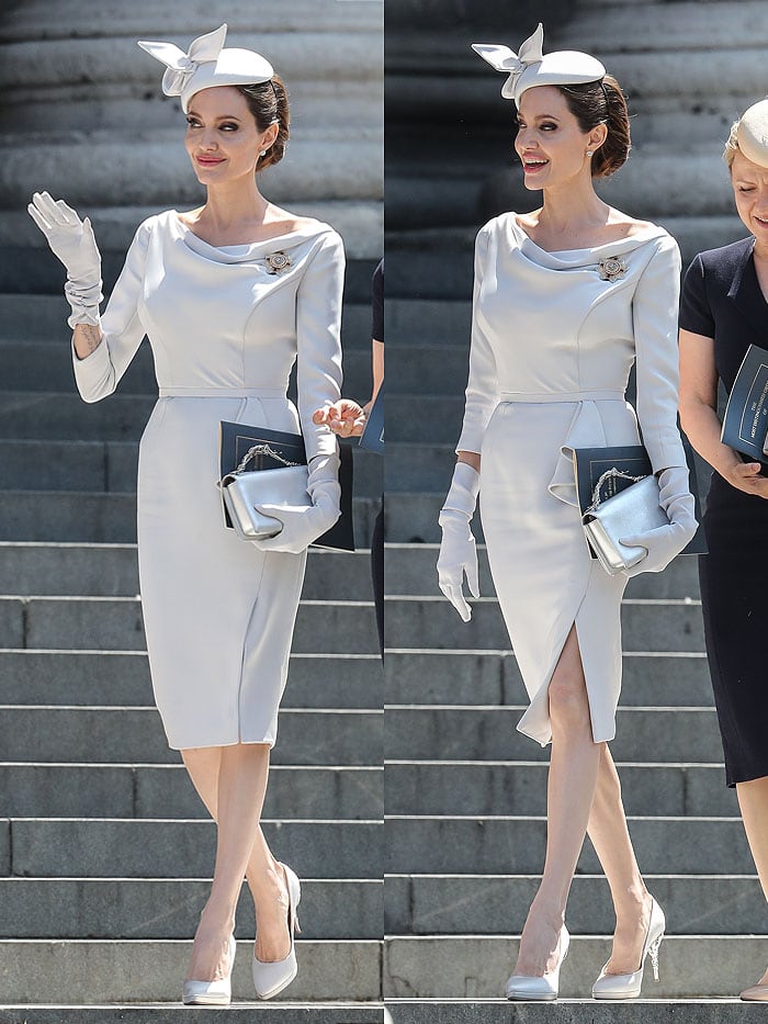 Angelina Jolie wearing a dove-gray Ralph & Russo dress, a fascinator hat, and gloves