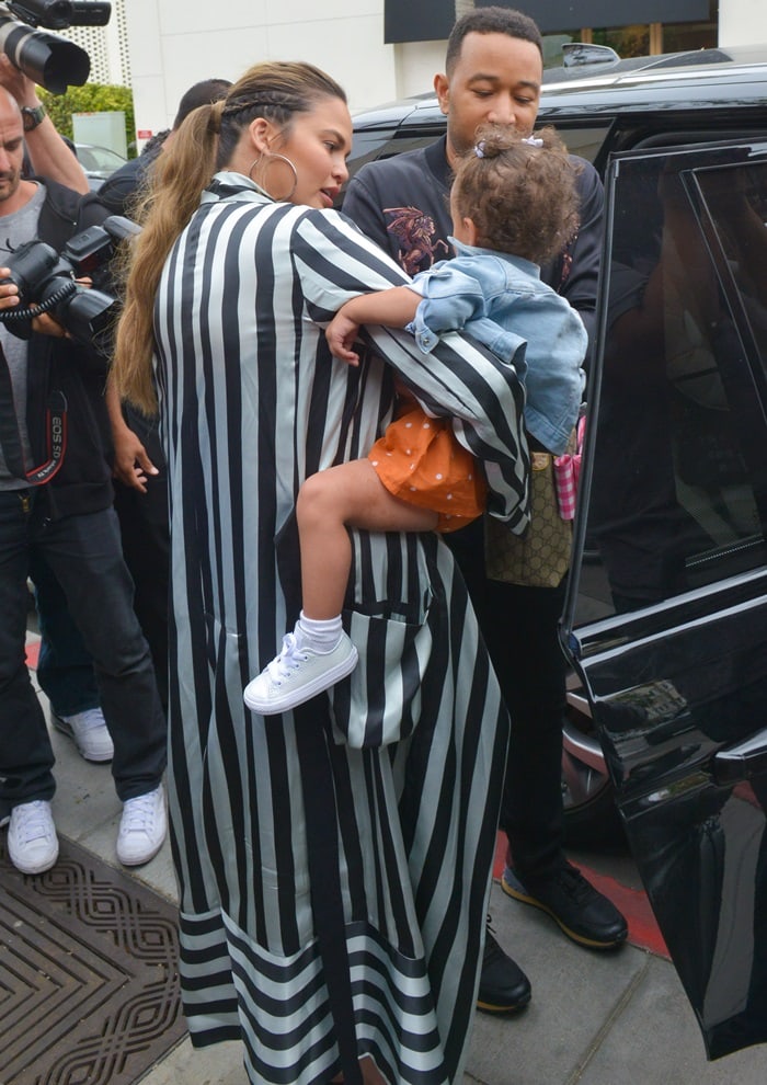 Chrissy Teigen, John Legend, and Luna leaving "Il Pastaio" restaurant in Beverly Hills on May 30, 2018