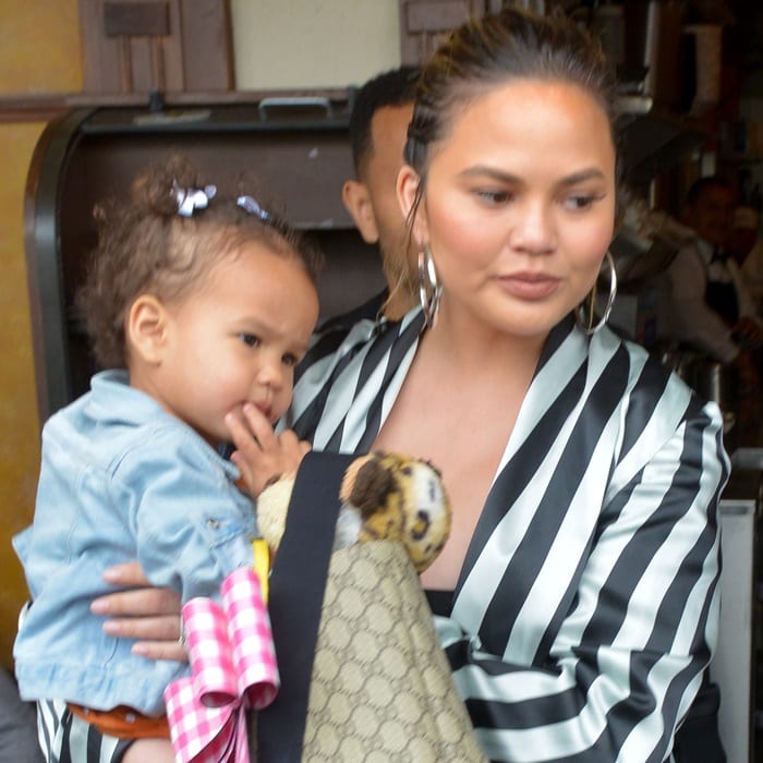 Chrissy Teigen accessorized with hoop earrings