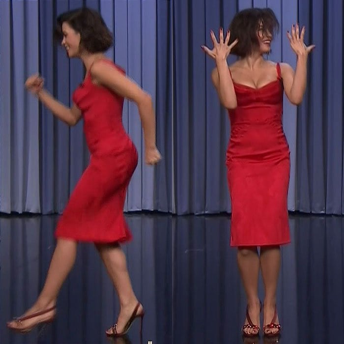 Jenna Dewan stunned in a form-fitting red satin Zac Posen dress featuring delicate ruching and spaghetti straps, perfectly paired with strappy four-inch Olgana Paris heels