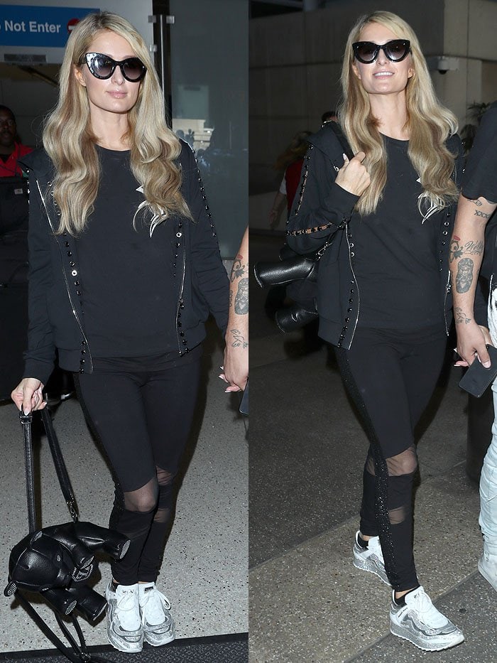 Paris Hilton wearing an all-black ensemble with a Philipp Plein bear backpack and Philipp Plein crystal sneakers.