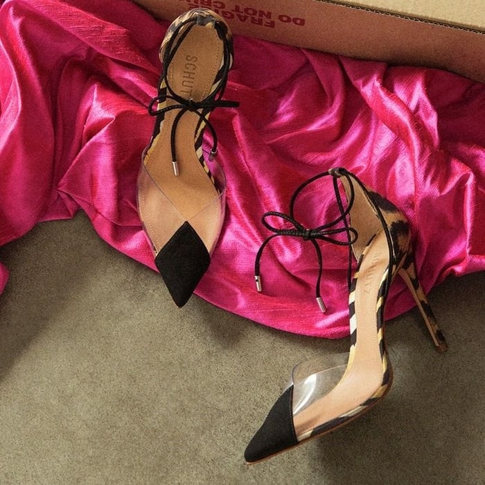 The Schutz S-Wild' pumps are a pair of high-heeled shoes that feature a pointed toe, a suede upper, and a platform heel