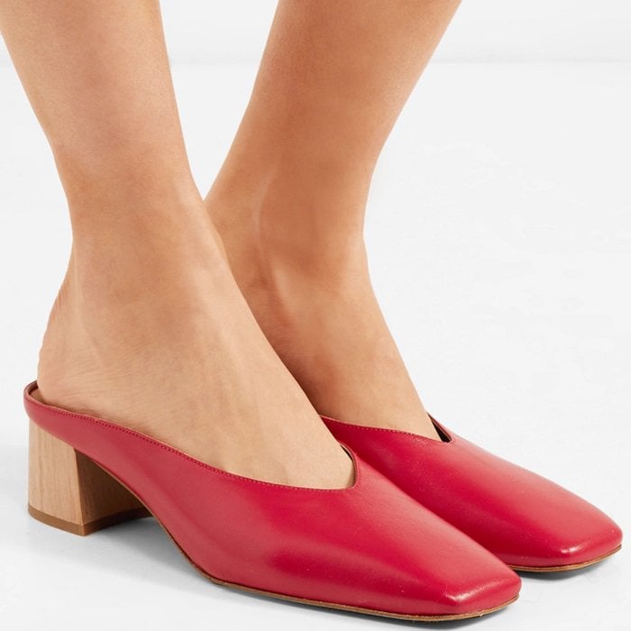 These mules rest on contrasting block heels and have angular, squared toes