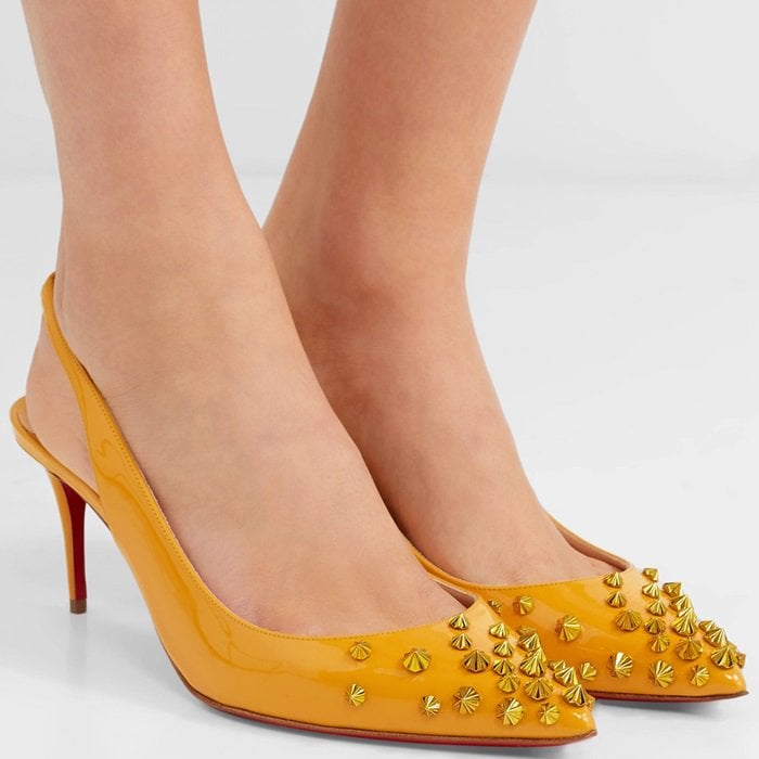 Christian Louboutin has never shied away from theatrics - these yellow 'Drama' pumps are embellished with polished metal spikes that reach out from the pointed toe.