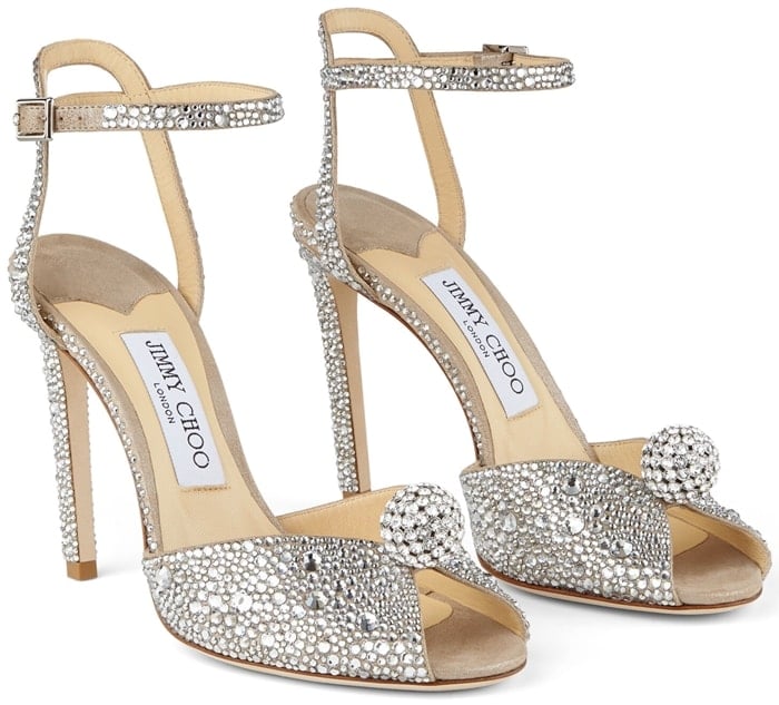 Sacora is a vintage-inspired sandal handcrafted in nude shimmer suede, embellished with a cascade of crystals