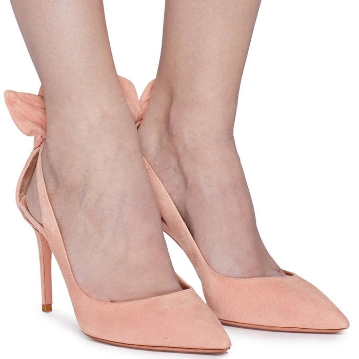 Renowned for its playful, feminine details, Aquazzura presents these Deneuve pumps with a bow at the counter