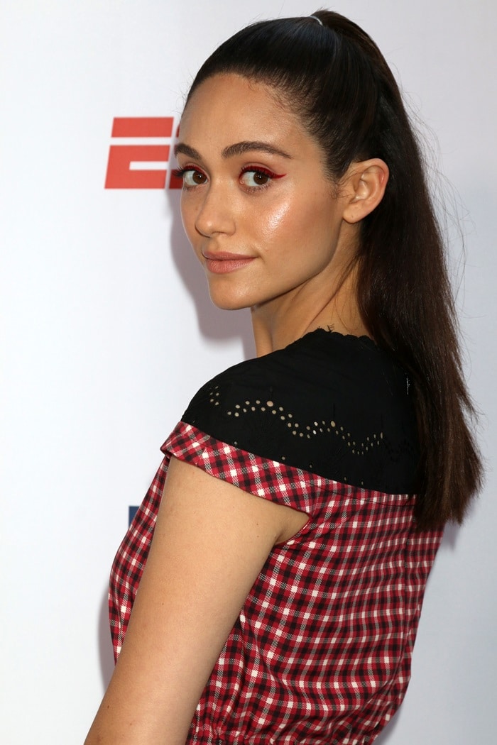 Emmy Rossum pairs her sleek high ponytail with bold red eyeliner, complementing her fresh and radiant makeup look for the 4th annual Sports Humanitarian Awards held at L.A. LIVE’s The Novo in Los Angeles