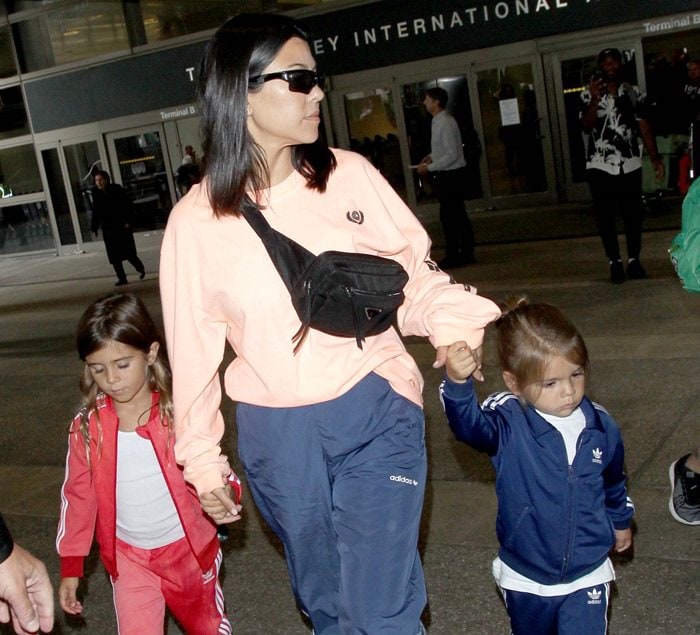 Kourtney Kardashian at Los Angeles International Airport (LAX) with her children on July 9, 2018