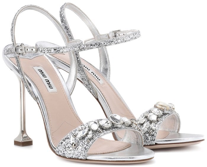 Resting on a sculptural heel, the thin toe band and dainty ankle straps have been decorated with dazzling crystals