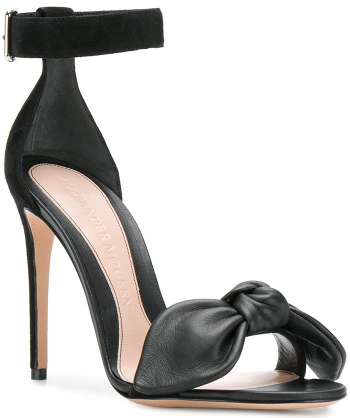 These black leather and suede bow detail stiletto sandals feature an ankle strap with a side buckle fastening, a high stiletto heel, a bow detail, an open toe and a brand embossed insole