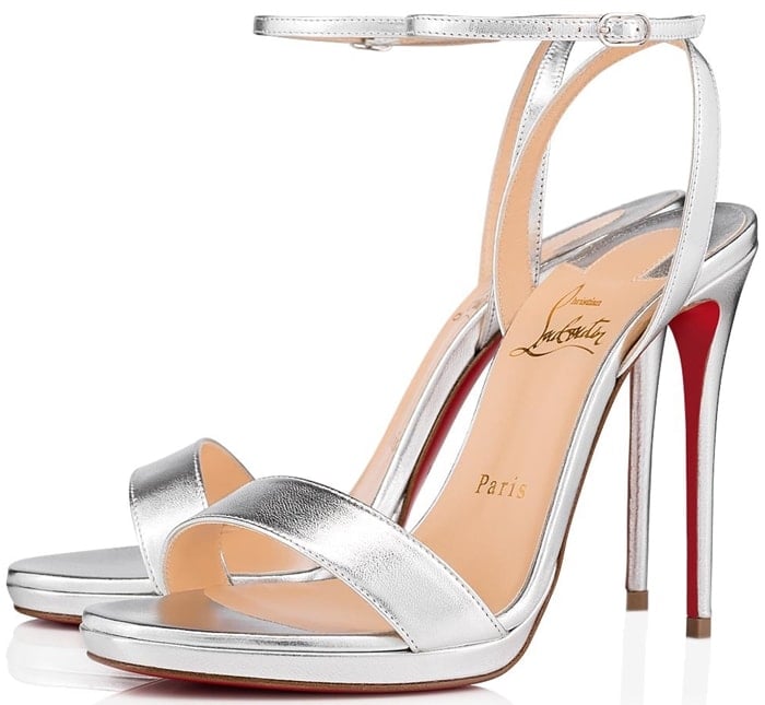 A slim platform and lofty 120mm wrapped stiletto add leg-lengthening lift to Christian Louboutin’s Loubi Queen in silver nappa laminata leather