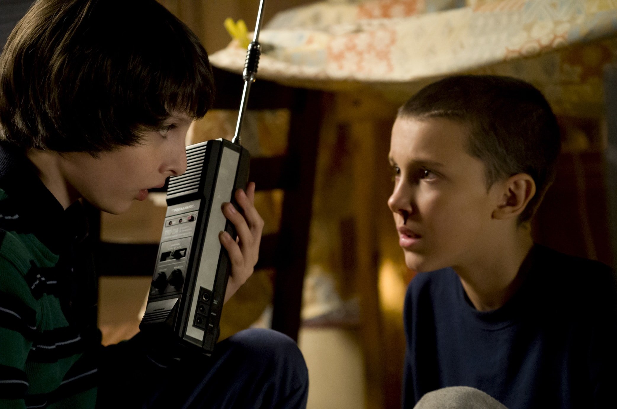 Finn Wolfhard as Mike Wheeler and Millie Bobby Brown as Eleven / Jane Hopper ("El") in Stranger Things