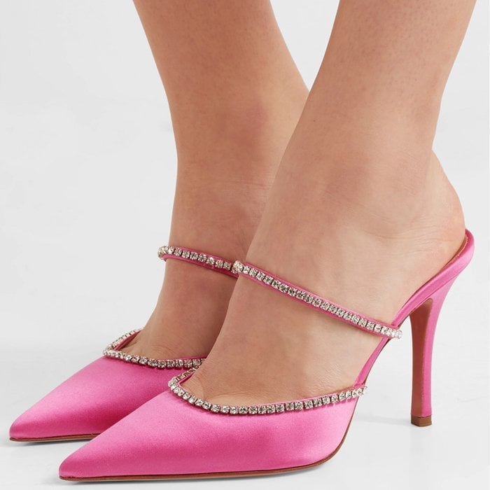 These vibrant pink satin mules feature straps and edges that are dotted with glistening Swarovski crystals