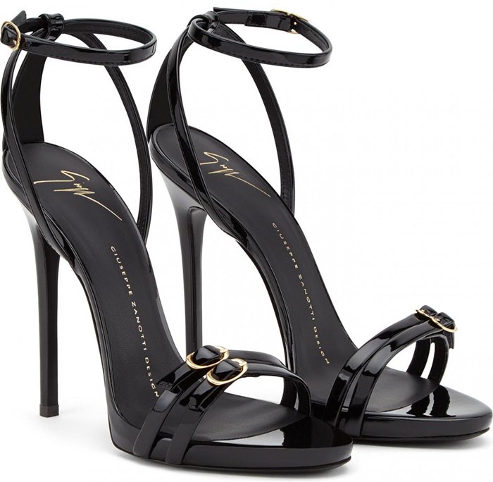 Exquisite Giuseppe Zanotti black patent leather sandals adorned with gold buckles