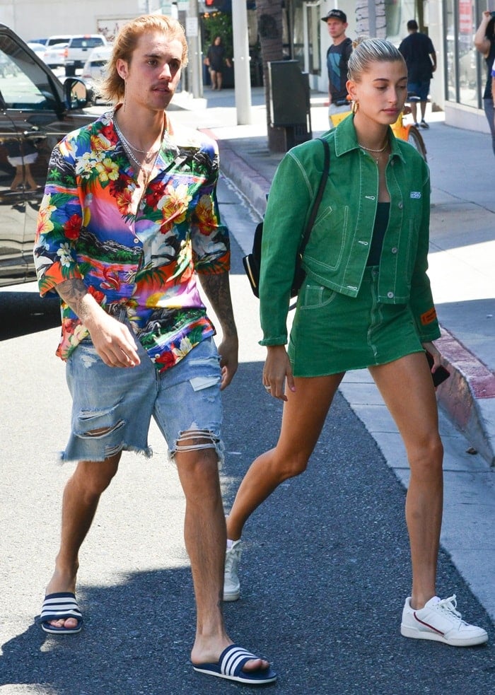 Hailey Baldwin flaunted her hot legs in a green Heron 'Preston' cotton crop denim jacket paired with a matching cotton workwear denim skirt