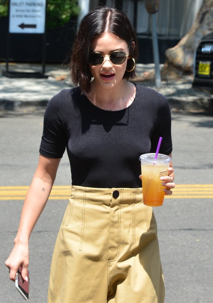 Lucy Hale makes a quick stop for a drink at Alfred's Coffee store on Melrose Place, Los Angeles, on August 17, 2018