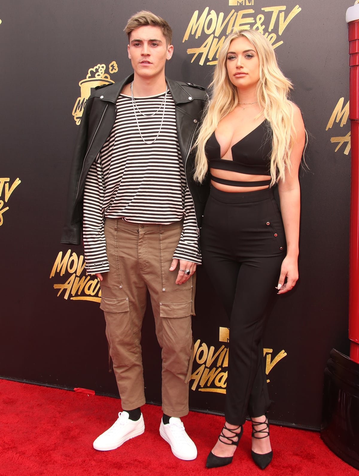 Anastasia Karanikolaou and Sam Wilkinson pose at a red carpet event in 2016