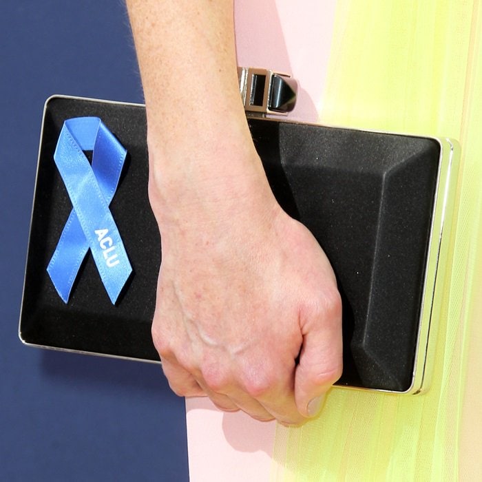 Alexis Bledel totes a Judith Leiber clutch with a blue ACLU ribbon to show support for the rights and civil liberties guaranteed by the Constitution to everyone in the United States