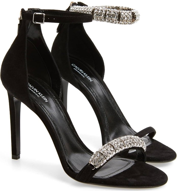 Rows of crystals dazzle and shine on a lofty, calfskin-suede sandal finished with a slim ankle strap.