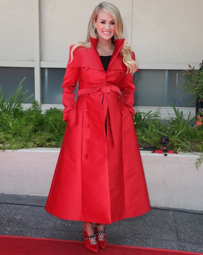 Carrie Underwood styled her coat with Maxine mules from Finnish shoe designer Minna Parikka