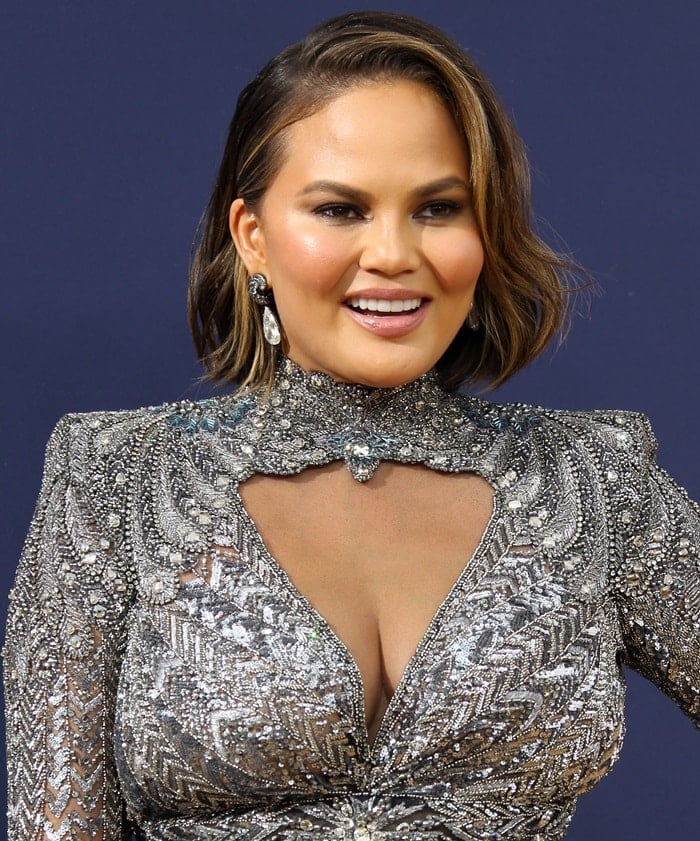 Chrissy Teigen flaunts her curves in an embellished gown from the Zuhair Murad Fall 2018 Couture Collection