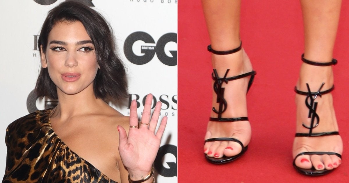 Dua Lipa Flaunts Feet & Legs in Cassandra Logo Sandals.