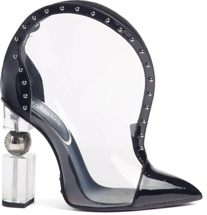 The sculptural heel with logo-engraved hardware balances the cutting-edge style